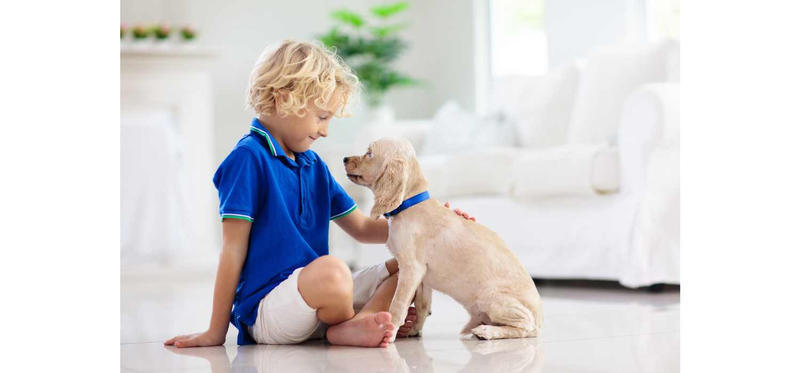 child with puppy