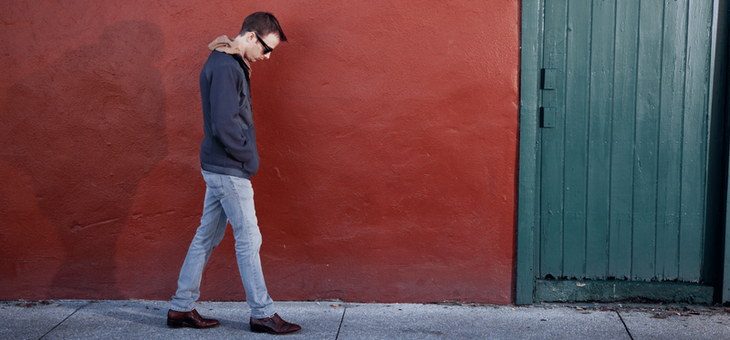 man walking looking sad