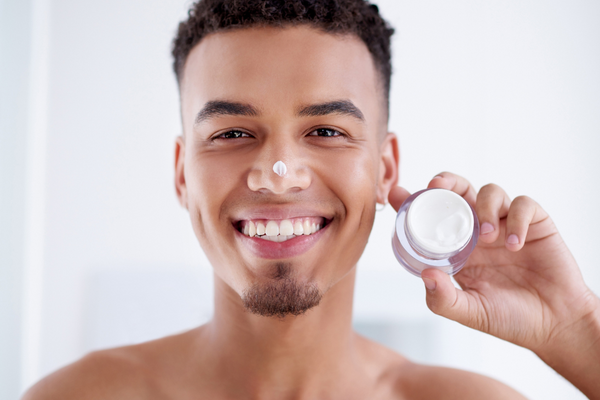 man using facial product