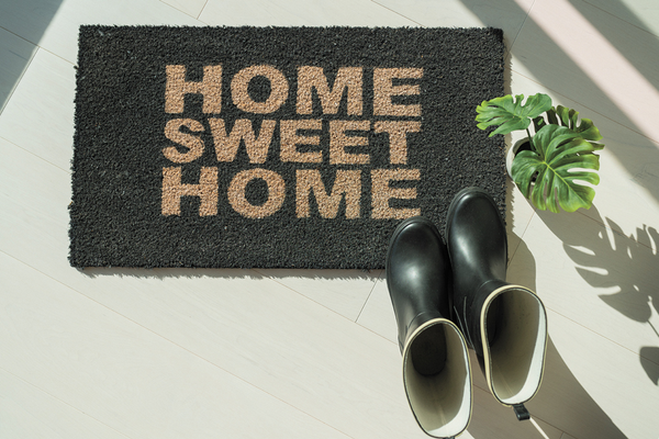 Taking shoes off outside of house