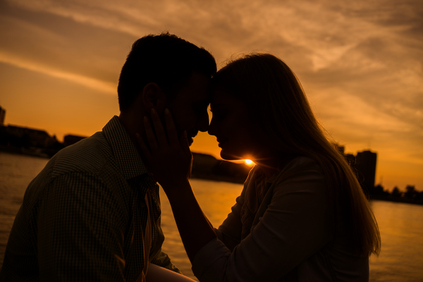 Couple in love with a sunset in the background